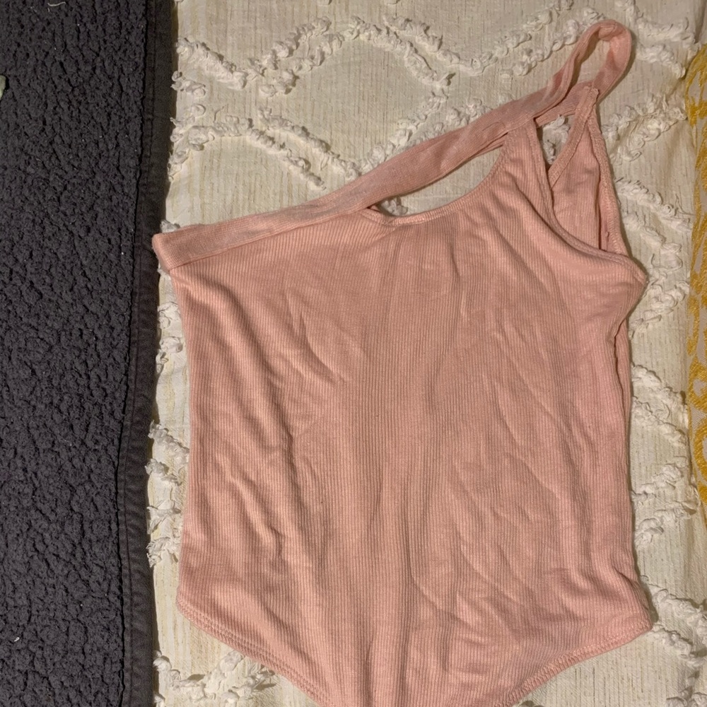 Pink one shoulder body suit